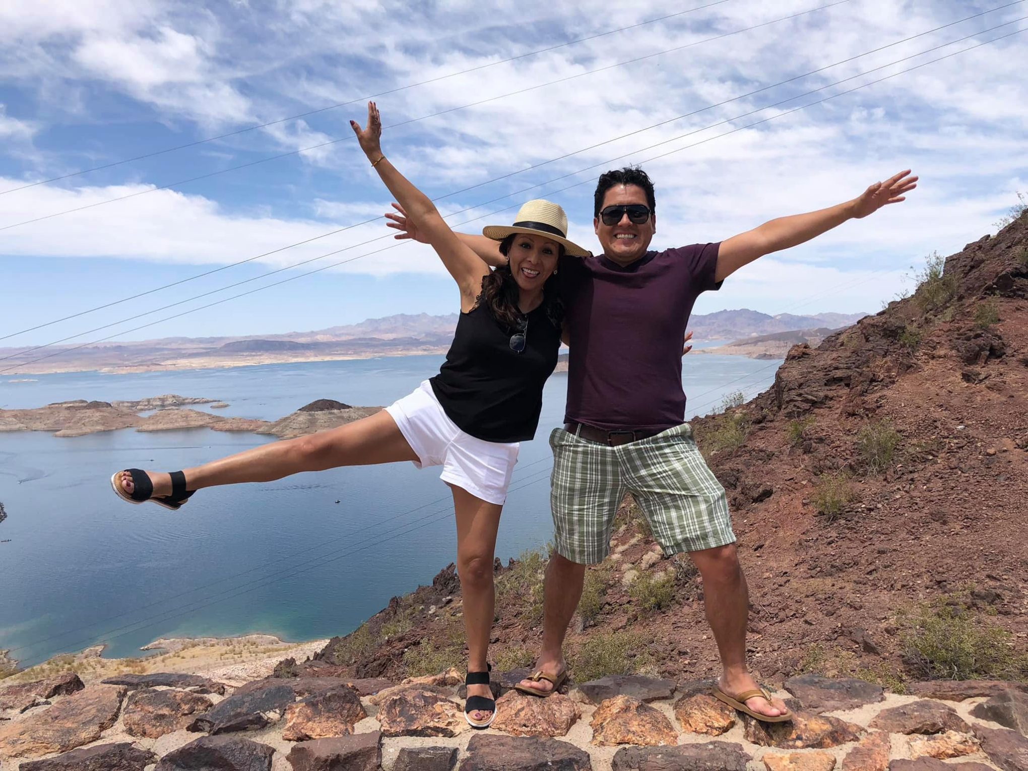 a man and a woman standing on the hoover dam