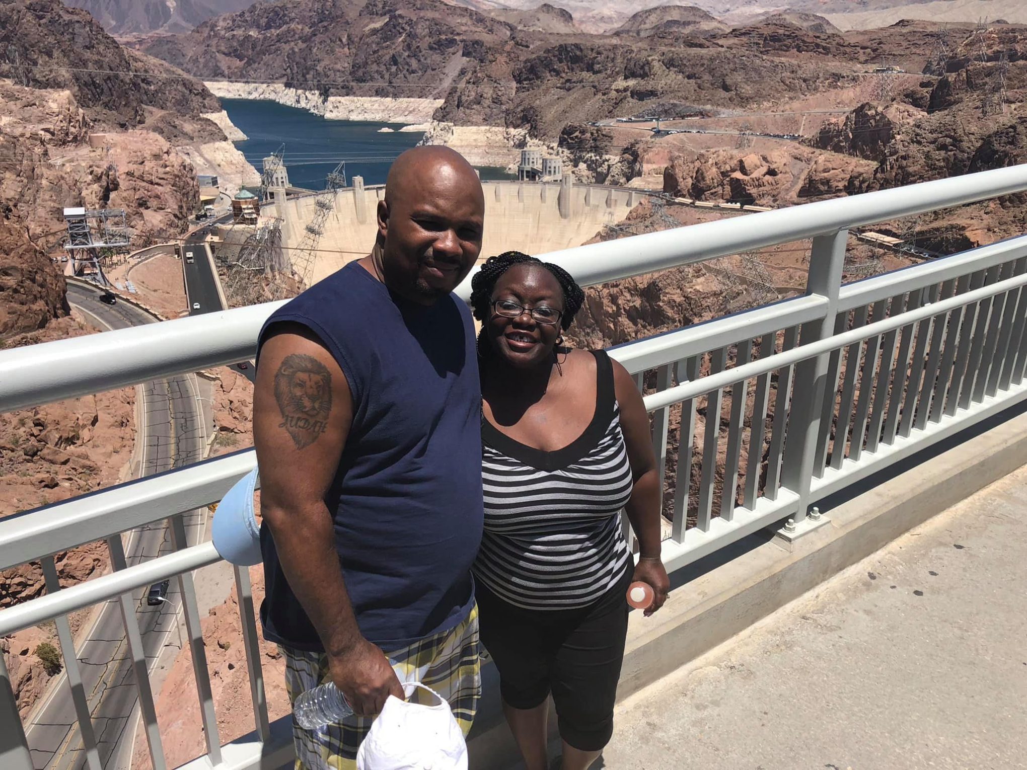 a man standing on top of the hoover dam