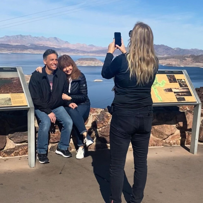 a group of people sitting at a beach