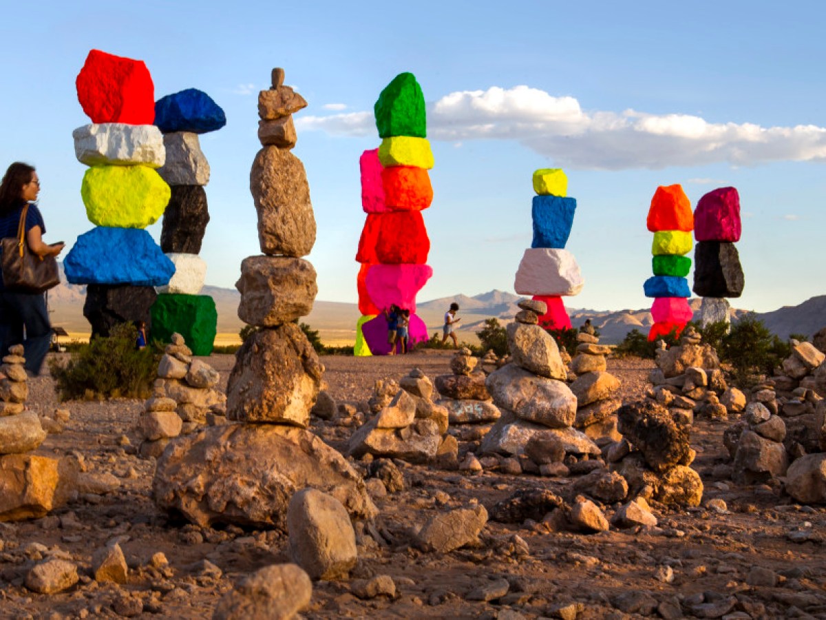 a group of people standing on a rock